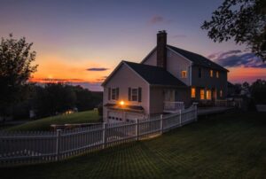 Beautiful Colonial Style House At Sunset